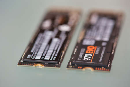 PISA, ITALY - FEBRUARY 12, 2020: NVME M2 SSD disks for data storage at high speed closeup on isolated backgroundのeditorial素材