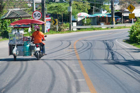 PHUKET, THAILAND - DECEMBER 19, 2019: Island roads with traffic on a sunny day. Phuket is a major...