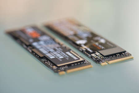 PISA, ITALY - FEBRUARY 12, 2020: NVME M2 SSD disks for data storage at high speed closeup on isolated backgroundのeditorial素材