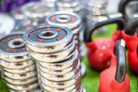 Stack of weights ready to use in a gym.の写真素材