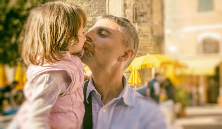 Father with daughter in a small town village.の写真素材
