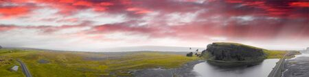Reynisfjara Beach and mountain landscape at summer sunset, Iceland.の写真素材