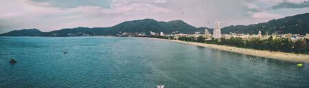 Aerial view of beautiful Patong Beach at sunset in Phuket, Thailand.