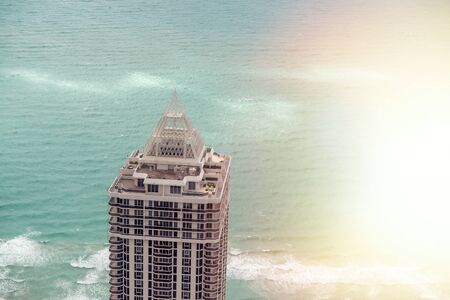Overhead aerial view of skyscraper top over the ocean, holiday concept.の写真素材