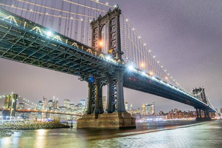 Amazing night view of Manhattan and Brooklyn Bridge at night, winter season, New York City lightsの写真素材