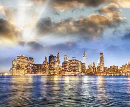 Lower Manhattan skyline at sunset, panoramic view from Brooklyn, New York - USA.の写真素材