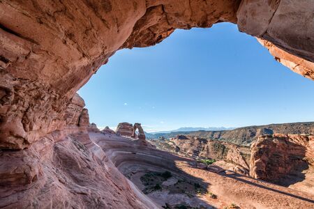 Delicate Arch framed by rocks in the morning, Arches National Park, USA.の写真素材