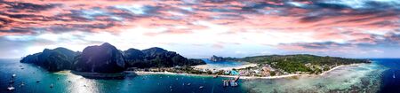 Panoramic aerial view of Tonsai Pier and Phi Phi Don coastline at sunset, Thailand.の写真素材
