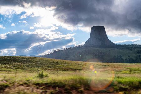 Devils Tower in natural landscape at sunset, Wyoming, United States.の写真素材