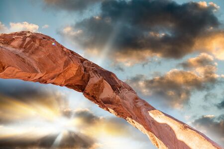 Skyward view of Delicate Arch, Arches National Park. Rock formation and blue sky, USAの写真素材