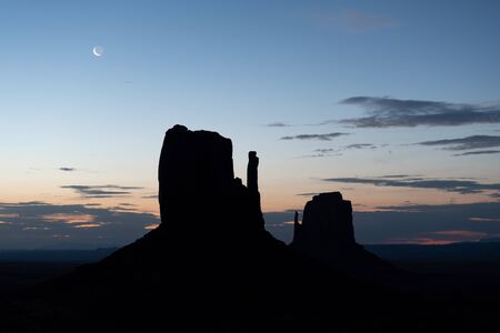 Buttes silhouettes of Monument Valley at dawn, USA.の写真素材