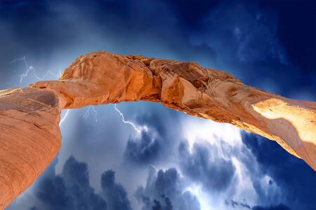 Upward skyward view of Delicate Arch, Arches National Park, Utah - USAの写真素材