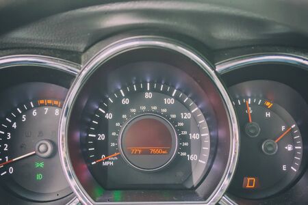 Car odometer, dashboard with lights and signs.の写真素材