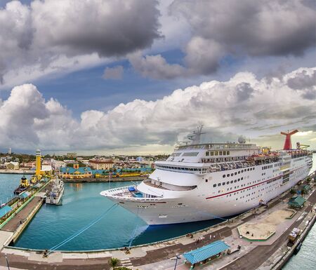 Cruise ship docked at Nassau Port, Bahamas. Amazing aerial view at duskの写真素材