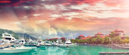 Beautiful Island port with boats and homes. Panoramic view at sunset. Eden Island.の写真素材