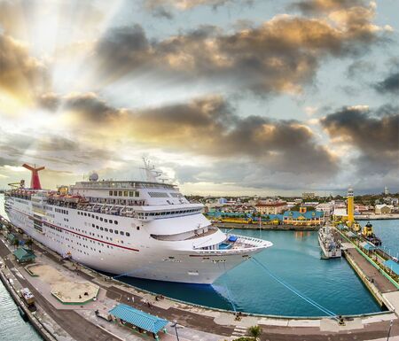 Amazing aerial view of cruise ship docked in a caribbean port at sunset. Vacation and relax concept.の写真素材