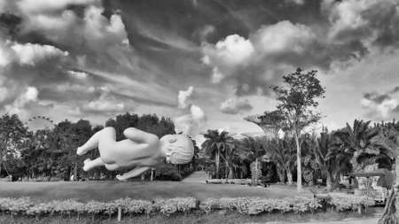 SINGAPORE - JANUARY 2, 2020: Aerial city landscape from Gardens by the Bay. Statue of Floating Baby in the air.のeditorial素材