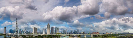 Panoramic aerial view of Singapore skyline from a drone point of view at dusk.
