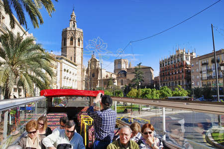VALENCIA, SPAIN - MARCH 4, 2007: Bus tour viisit city streets on a beautiful sunny day.のeditorial素材