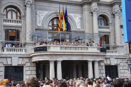 VALENCIA, SPAIN - MARCH 4, 2007: People on a city terrace over Town Hall Square for Valencia`s Fallas festival.のeditorial素材