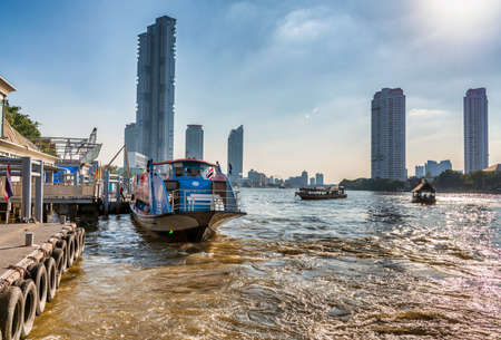 BANGKOK - DECEMBER 14,2019: Boat along Chao Phraya river on a sunny day. The cruise is a famous tourist attraction.のeditorial素材