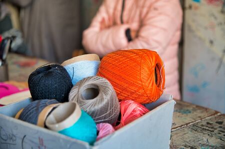 Different color balls of threads wool yarn isolated, lab in background.の写真素材