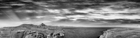 Arnarstapi coastline in sumemr season, Snaefellsnes peninsula, Iceland. Panoramic aerial view from drone at sunset.の写真素材