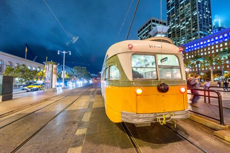 SAN FRANCISCO, CA - AUGUST 7, 2017: Yellow tram at night in Embarcadero area.の写真素材