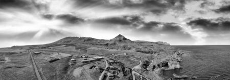 Arnarstapi coastline in sumemr season, Snaefellsnes peninsula, Iceland. Panoramic aerial view from drone at sunset.の写真素材