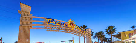 Panama City Beach Pier entrance sign at sunset, Florida.のeditorial素材