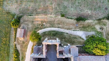 Amazing aerial view of beautiful San Galgano Abbey with roofless walls, Tuscany Hills in spring season, Italy.の写真素材