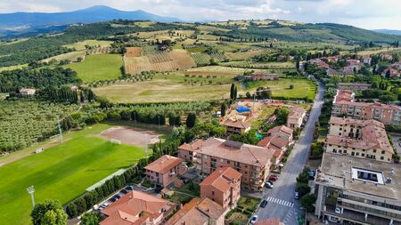 Amazing aerial view of San Quirico medieval town in Tuscany, Italyの写真素材