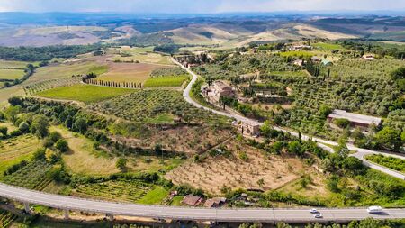 Amazing aerial view of San Quirico medieval town in Tuscany, Italyの写真素材