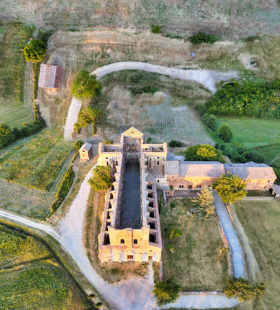 Amazing aerial view of beautiful San Galgano Abbey with roofless walls, Tuscany Hills in spring season, Italy.のeditorial素材