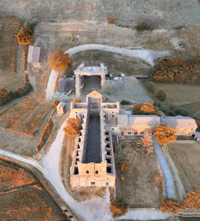 Amazing aerial view of beautiful San Galgano Abbey with roofless walls, Tuscany Hills in spring season, Italy.のeditorial素材