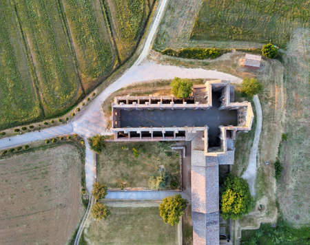 Amazing aerial view of beautiful San Galgano Abbey with roofless walls, Tuscany Hills in spring season, Italy.のeditorial素材