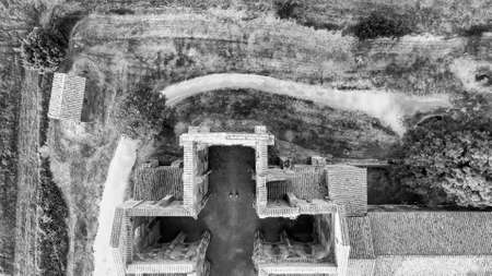 Amazing aerial view of beautiful San Galgano Abbey with roofless walls, Tuscany Hills in spring season, Italy.のeditorial素材