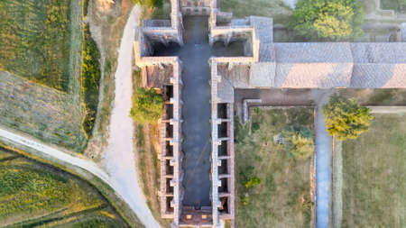 Amazing aerial view of beautiful San Galgano Abbey with roofless walls, Tuscany Hills in spring season, Italy.のeditorial素材