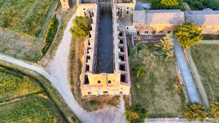 Amazing aerial view of beautiful San Galgano Abbey with roofless walls, Tuscany Hills in spring season, Italy.のeditorial素材