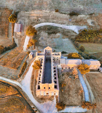 Amazing aerial view of beautiful San Galgano Abbey with roofless walls, Tuscany Hills in spring season, Italy.のeditorial素材