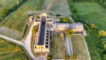 Amazing aerial view of beautiful San Galgano Abbey with roofless walls, Tuscany Hills in spring season, Italy.のeditorial素材