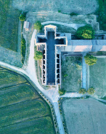 Amazing aerial view of beautiful San Galgano Abbey with roofless walls, Tuscany Hills in spring season, Italy.のeditorial素材
