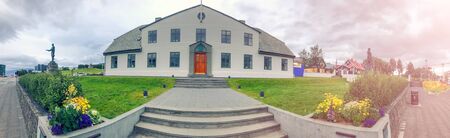 REYKJAVIK, ICELAND - AUGUST 11, 2019: Prime Minister Office at summer sunset with tourists.の写真素材