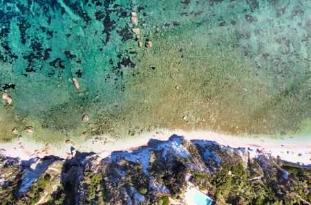 Elba Island, Italy. Amazing downward aerial view from drone of Capo Bianco Beach near Portoferraio.の写真素材