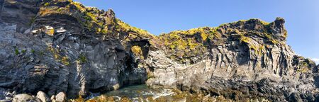 Panoramic view of Arnarstapi coastline, Iceland. Snaefellsnes rocks in summer season.の写真素材