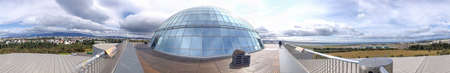 REYKJAVIK, ICELAND - AUGUST 11, 2019: Perlan Wonders of Iceland glass-domed fine restaurant terrace on a sunny summer day.のeditorial素材