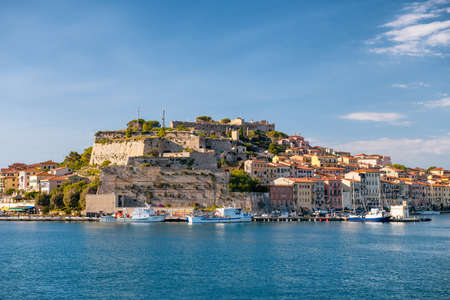 PORTOFERRAIO, ITALY - JUNE 22, 2020: City buildings of Elba Island on a sunny day.のeditorial素材