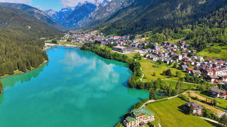 Alpin lake in summer time surrounded by beautiful forest, overhead downward aerial view.の写真素材