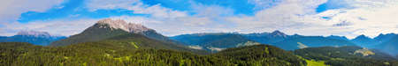Alpin lake in summer time surrounded by beautiful forest, overhead downward aerial view.の写真素材