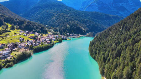 Alpin lake and dam in summertime, view from drone, Auronzo, italian dolomites.の写真素材